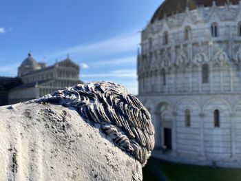 Close-up of religious building against sky