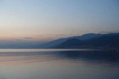 Scenic view of sea against clear sky during sunset