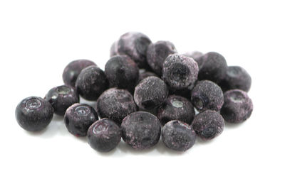 Close-up of blueberries against white background