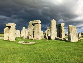 Ruins of castle against cloudy sky