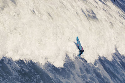 High angle view of person surfing in snow