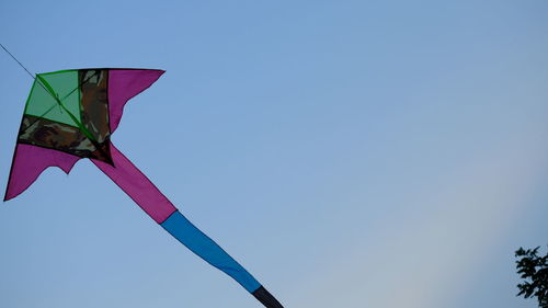 Low angle view of flag against clear sky