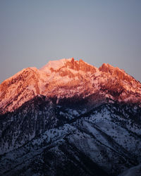 Scenic view of snowcapped mountains against clear sky