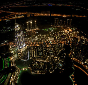 Aerial view of illuminated city at night
