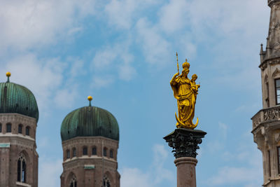 Low angle view of statue of building against sky