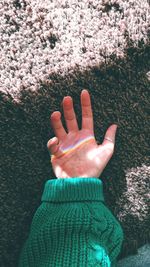 Low section of woman's hand with rainbow 