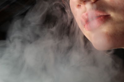 Close-up of man smoking