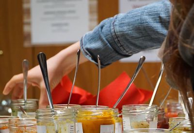 Woman picking jar at store