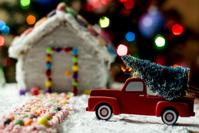 Close-up of toy car on christmas tree during winter