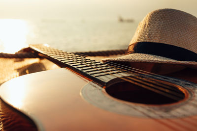 Close-up of guitar on table