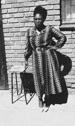 Portrait of young woman sitting on chair