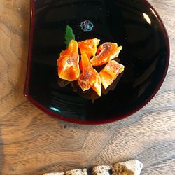 High angle view of orange slices in bowl on table