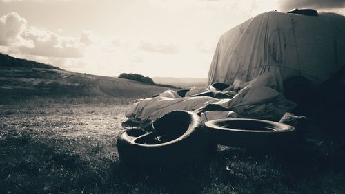 Abandoned tractor on field against sky