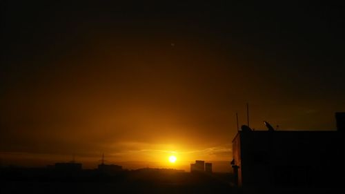 Silhouette of buildings at sunset