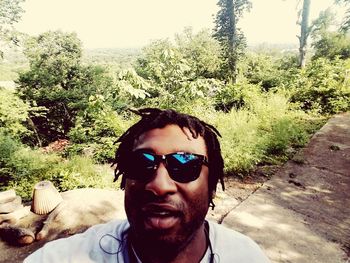 Portrait of young man wearing sunglasses