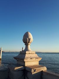 Close-up of statue against clear blue sky