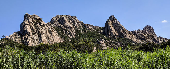 Low angle view of rocks against sky