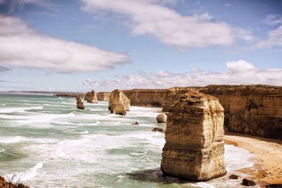 Scenic view of sea against cloudy sky