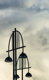 Silhouette of playground against sky