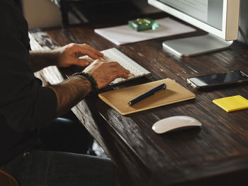 High angle view of man preparing food on cutting board