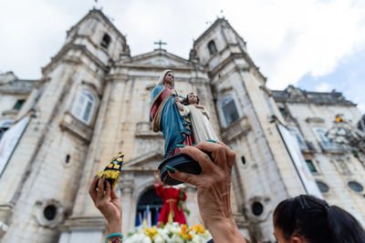 Low angle view of statue against sky