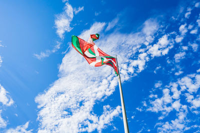 Low angle view of crane against blue sky