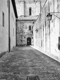 Alley amidst buildings in city