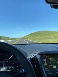 View of airplane seen through car windshield