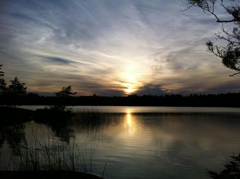 Scenic view of lake at sunset