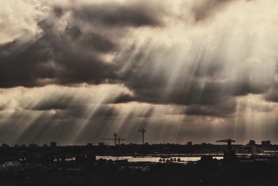 City skyline against cloudy sky