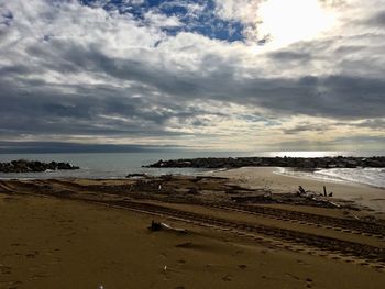 Scenic view of beach against sky