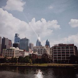 City skyline against cloudy sky