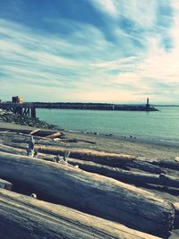 Scenic view of sea against cloudy sky