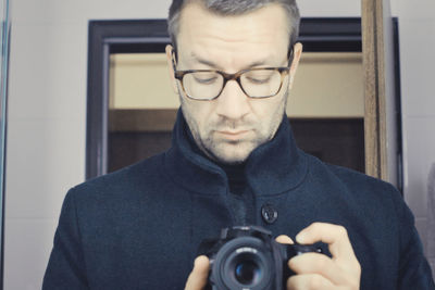 Portrait of man photographing