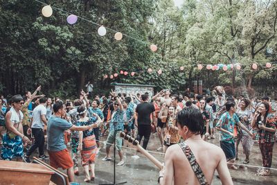 People dancing in city during celebration