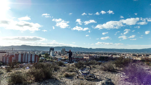 Scenic view of city and buildings against sky