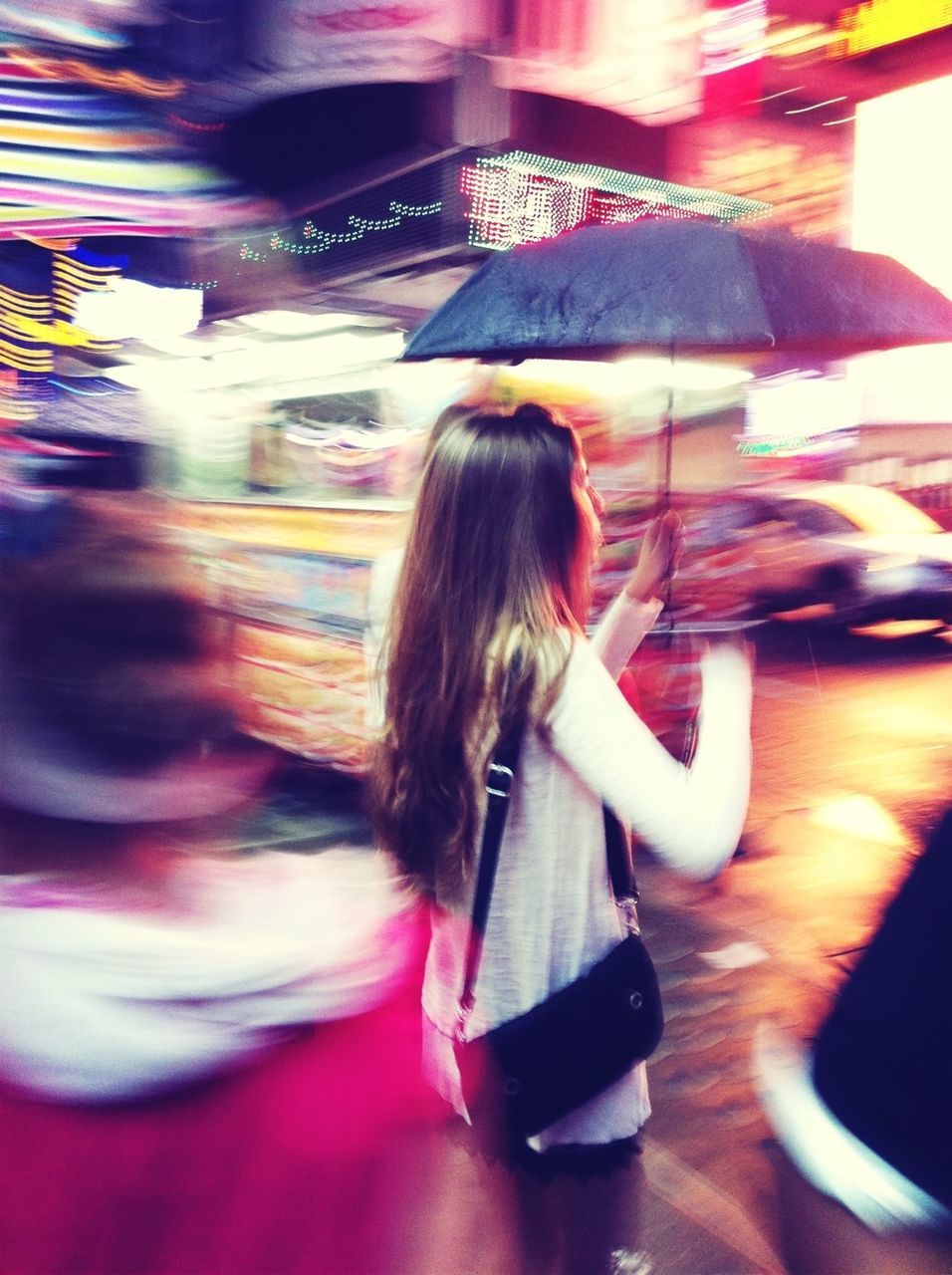 lifestyles, leisure activity, long hair, indoors, young women, illuminated, young adult, casual clothing, blurred motion, person, enjoyment, standing, night, sitting, fun, motion, girls