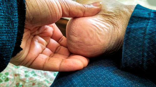 Close-up of hands holding baby