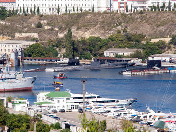 Boats moored at harbor