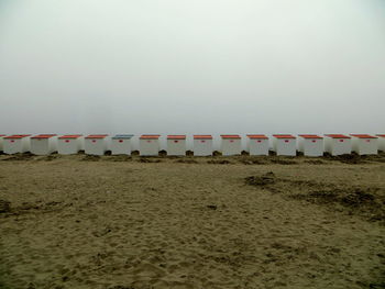 Built structure on sand against clear sky