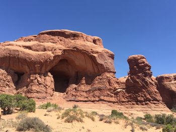 Rock formations against blue sky