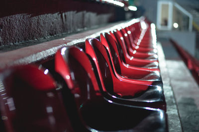 Red empty seats in stadium