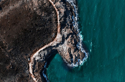 High angle view of rock formation on beach