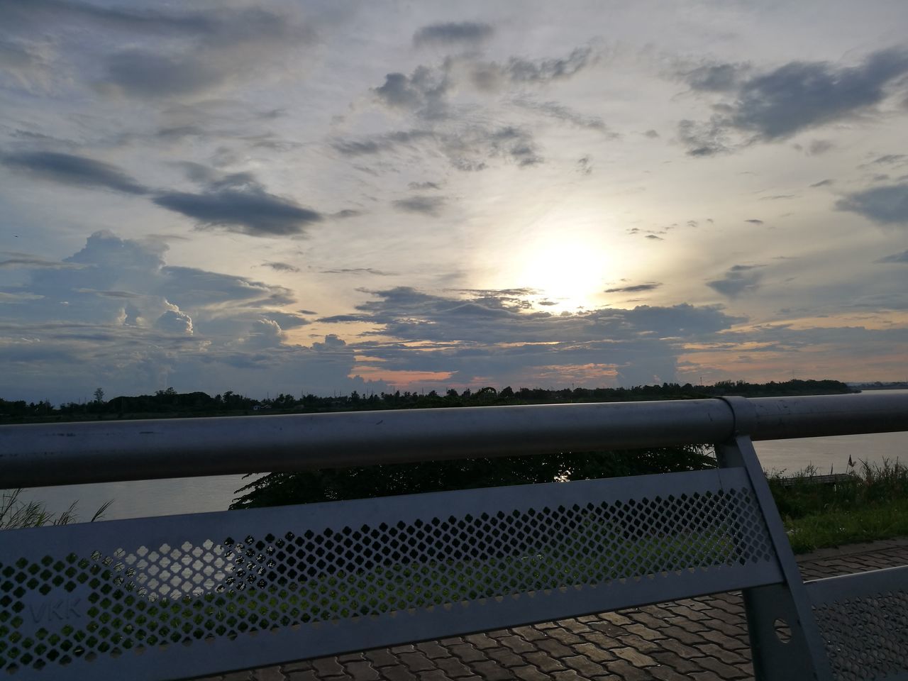 sky, sun, sunset, cloud - sky, water, scenics, tranquil scene, tranquility, sunlight, beauty in nature, sunbeam, nature, idyllic, cloud, lake, railing, cloudy, sea, landscape, outdoors