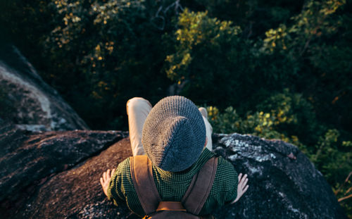 Rear view of woman wearing hat in forest