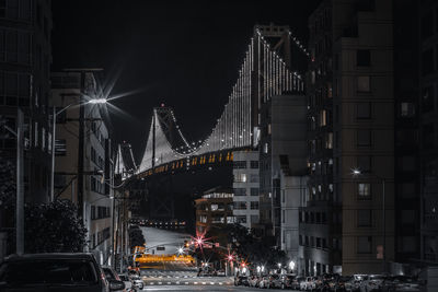 Illuminated city street at night