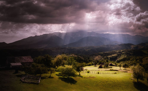 Scenic view of mountains against cloudy sky