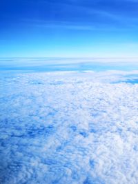 Aerial view of clouds over sea against sky