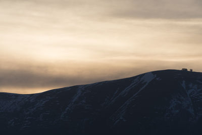 Scenic view of mountain against sky during sunset