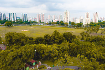 High angle view of trees and buildings against sky